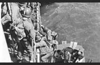 D-2) U.S. troops loading onto an LCVP (Higgins boat). US Navy