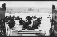 D-4) U.S. soldiers wade to shore through Nazi gun and mortar fire. US Coast Guard