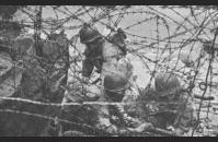 A-5) Barbed wire on a Normandy beach. US Army